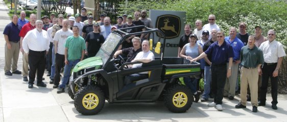GVP Philip J. Gruber and Steve Johnson, Factory Manager at John Deere Horicon Works, along with IAM members who run the John Deere Gator line, the John Deere management team, IAM Local 873 leadership and IAM District 10 representatives.
