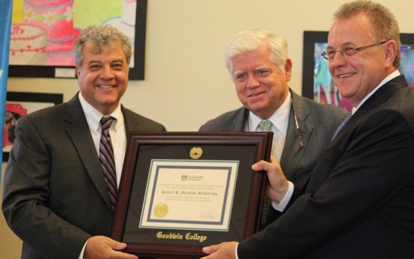 Goodwin College President Mark Scheinberg, left, and Congressman John Larson (D-CT), center, present IAM Headquarters General Vice President Rich Michalski, right, with a certificate commemorating the new Richard P. Michalski Scholarship program.