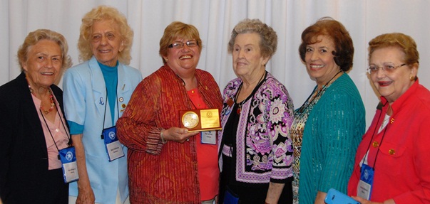 Lehman poses with the award and fellow delegates at the National Federation of Democratic Women’s conference in Charleston, WV. 