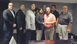 The IAM Auditors Association is now a reality. From left: IAM General Vice Presidents Brian Bryant and James Conigliaro, Sr., IAM International President Bob Martinez, IAM General Secretary-Treasurer Dora Cervantes, General Vice President Rickey Wallace, Auditors Association President Pat Smutney, Auditors Association Secretary-Treasurer Paul Kendall, and Grand Lodge Auditor Rick Fischer. 