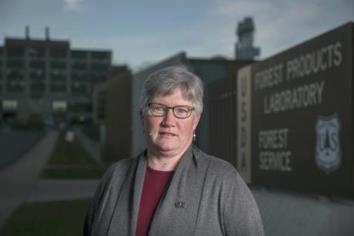 NFFE-IAM member Melissa Baumann, a chemist, stands outside of her facility in Madison, WI. (Photo: Andy Manis/Associated Press)